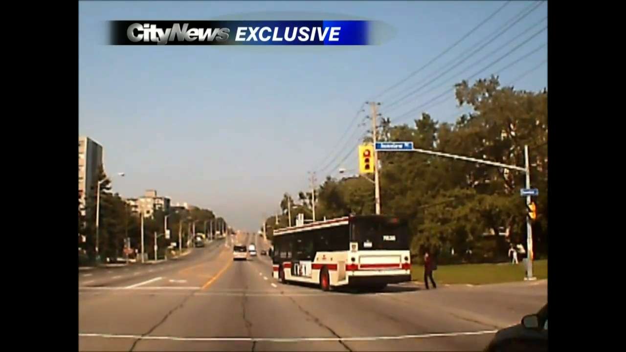 Dashcam captures TTC bus running red; nearly striking pedestrian